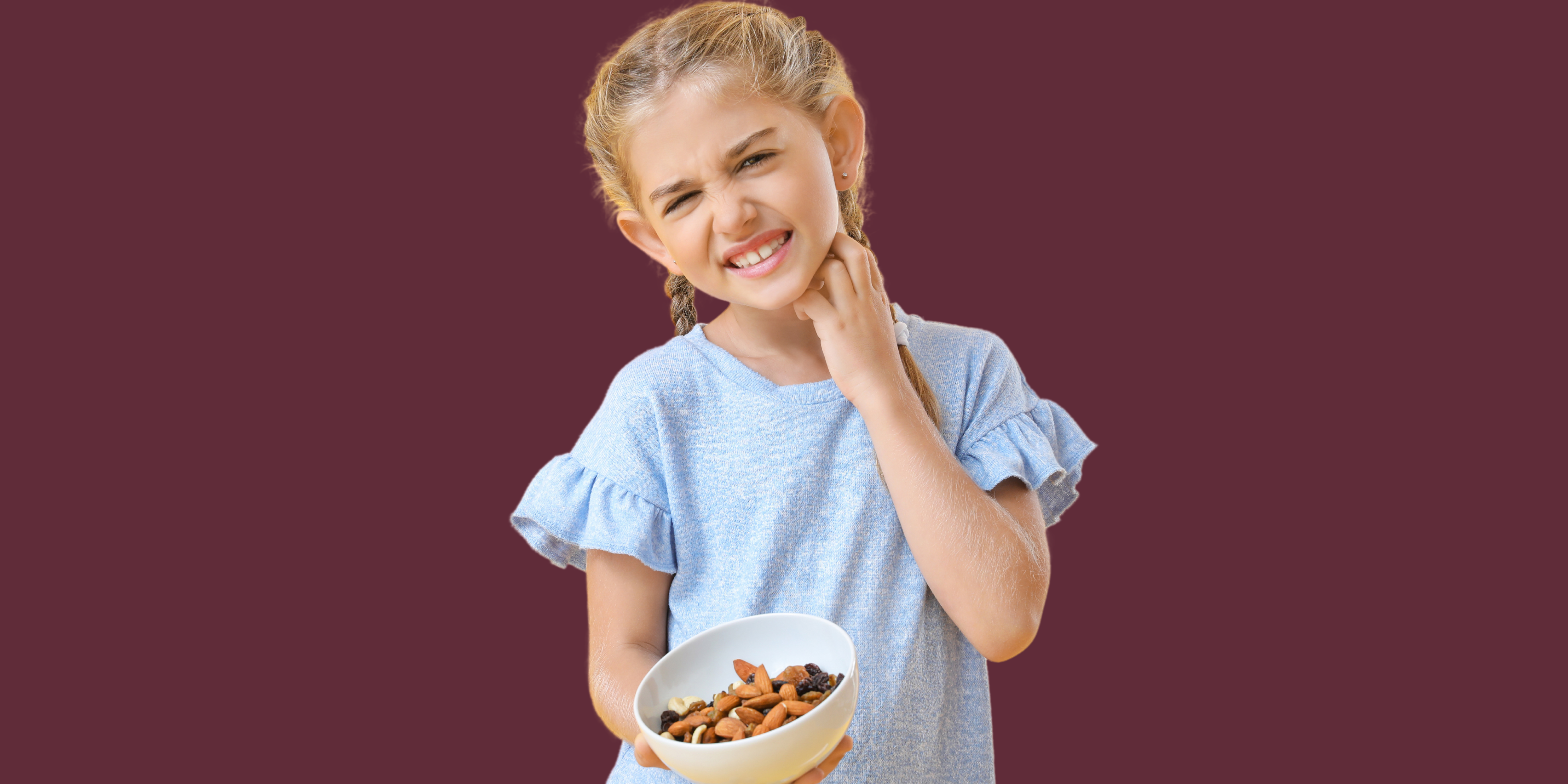 young child holding bowl of food